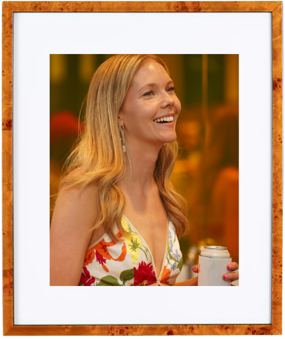 Carrah smiling at her elopement after party in a floral dress