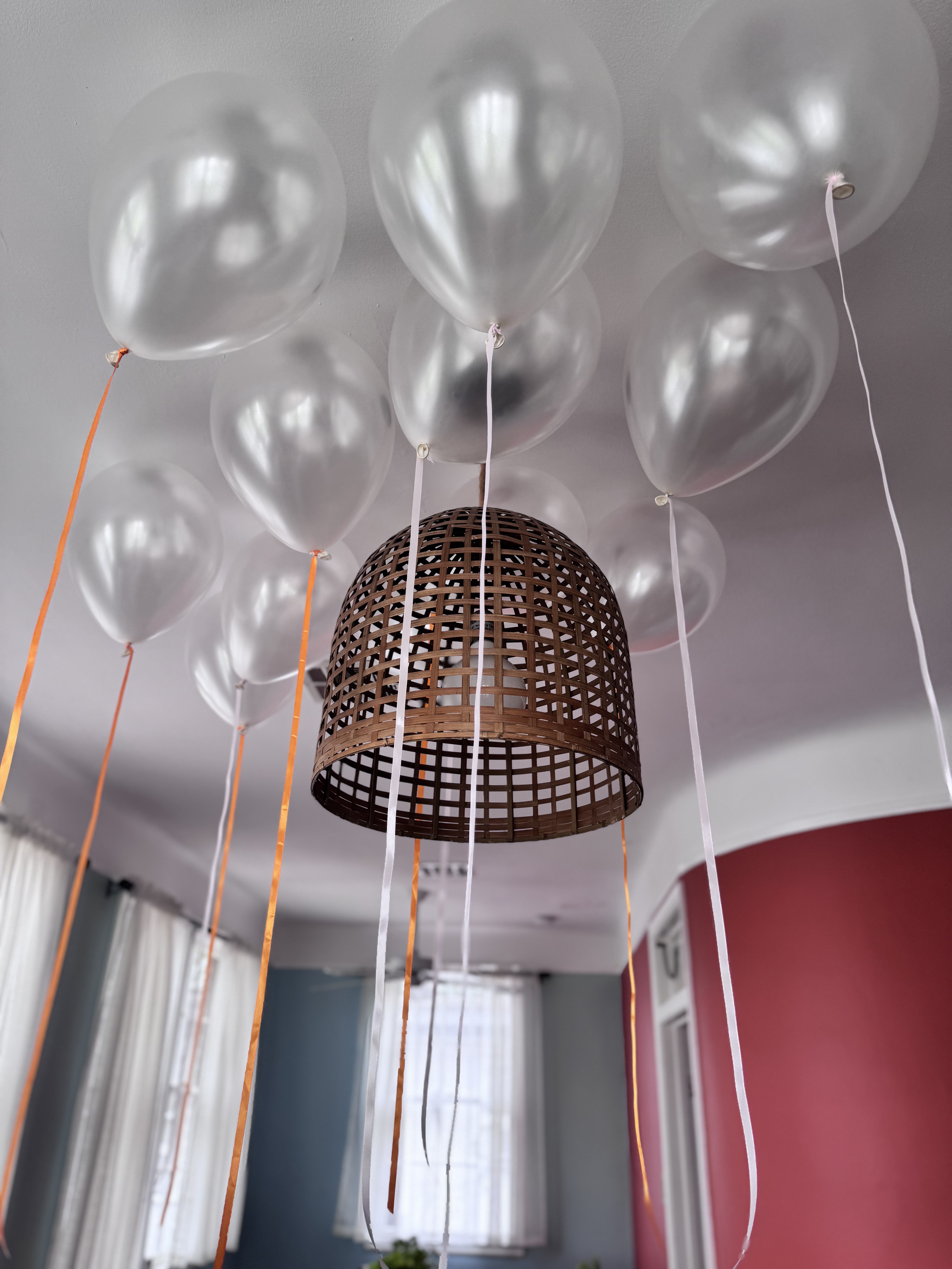 Pearl balloons with pink and orange ribbons