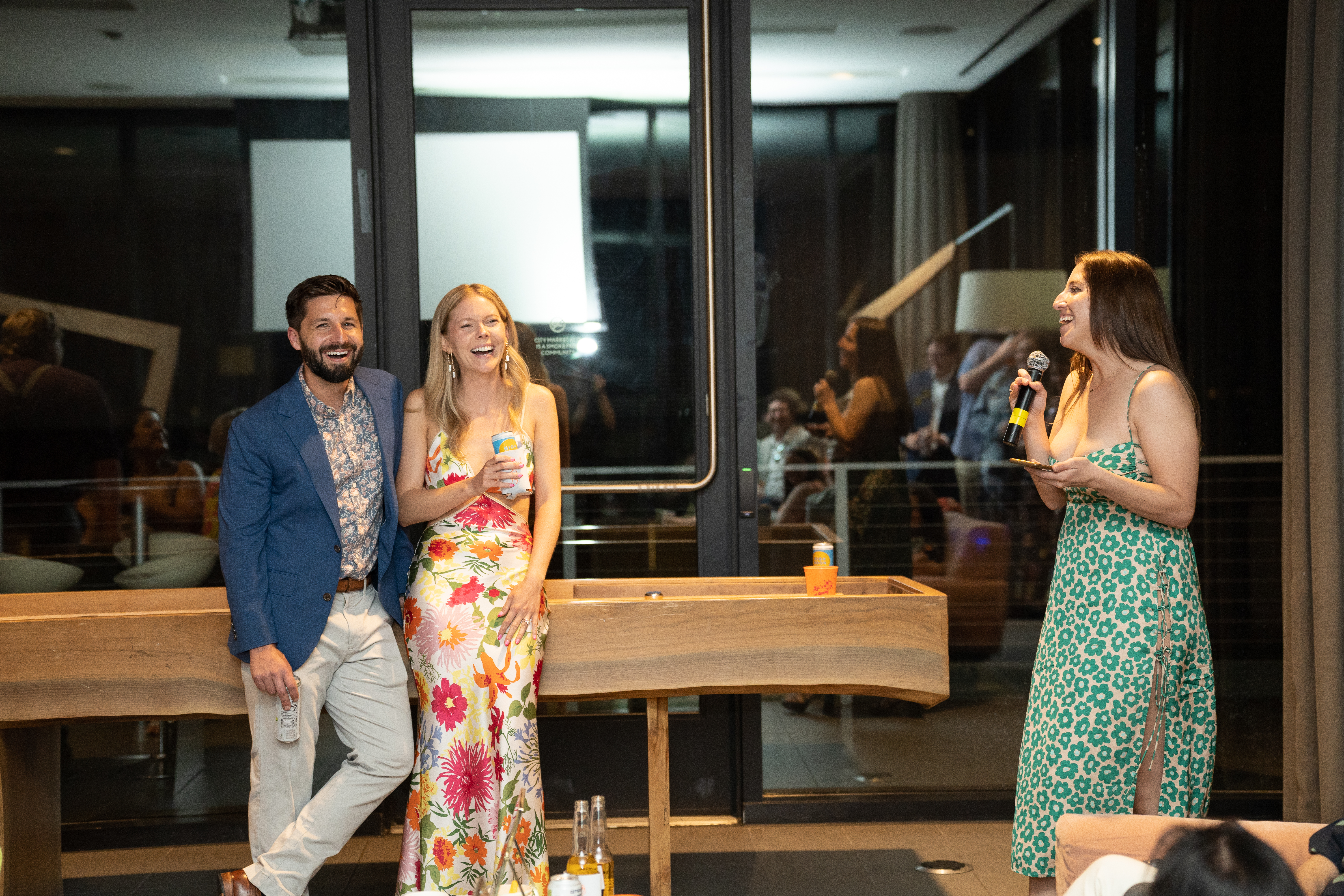 Friend giving a speech while couple laughs