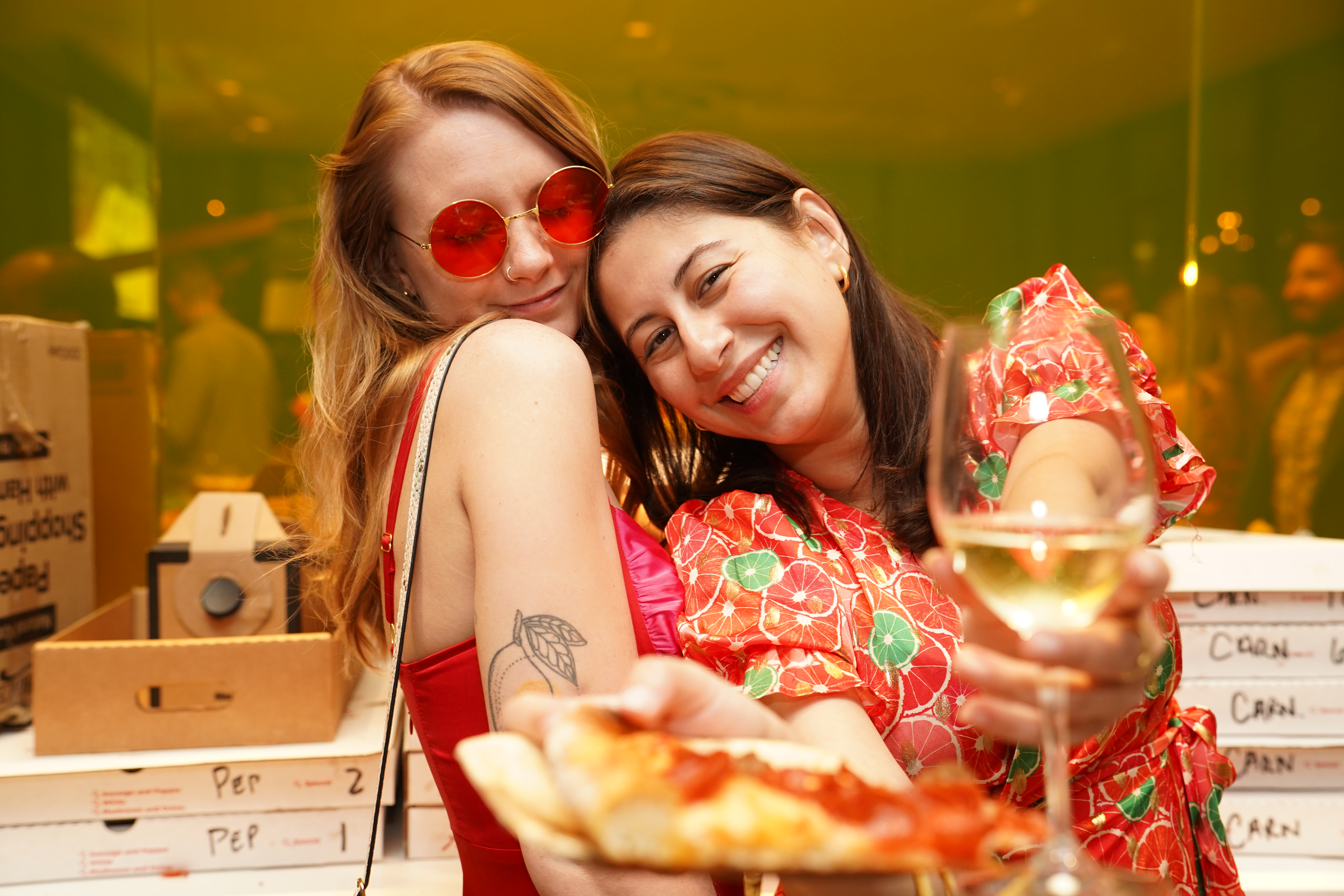 Friends with pizza and wine