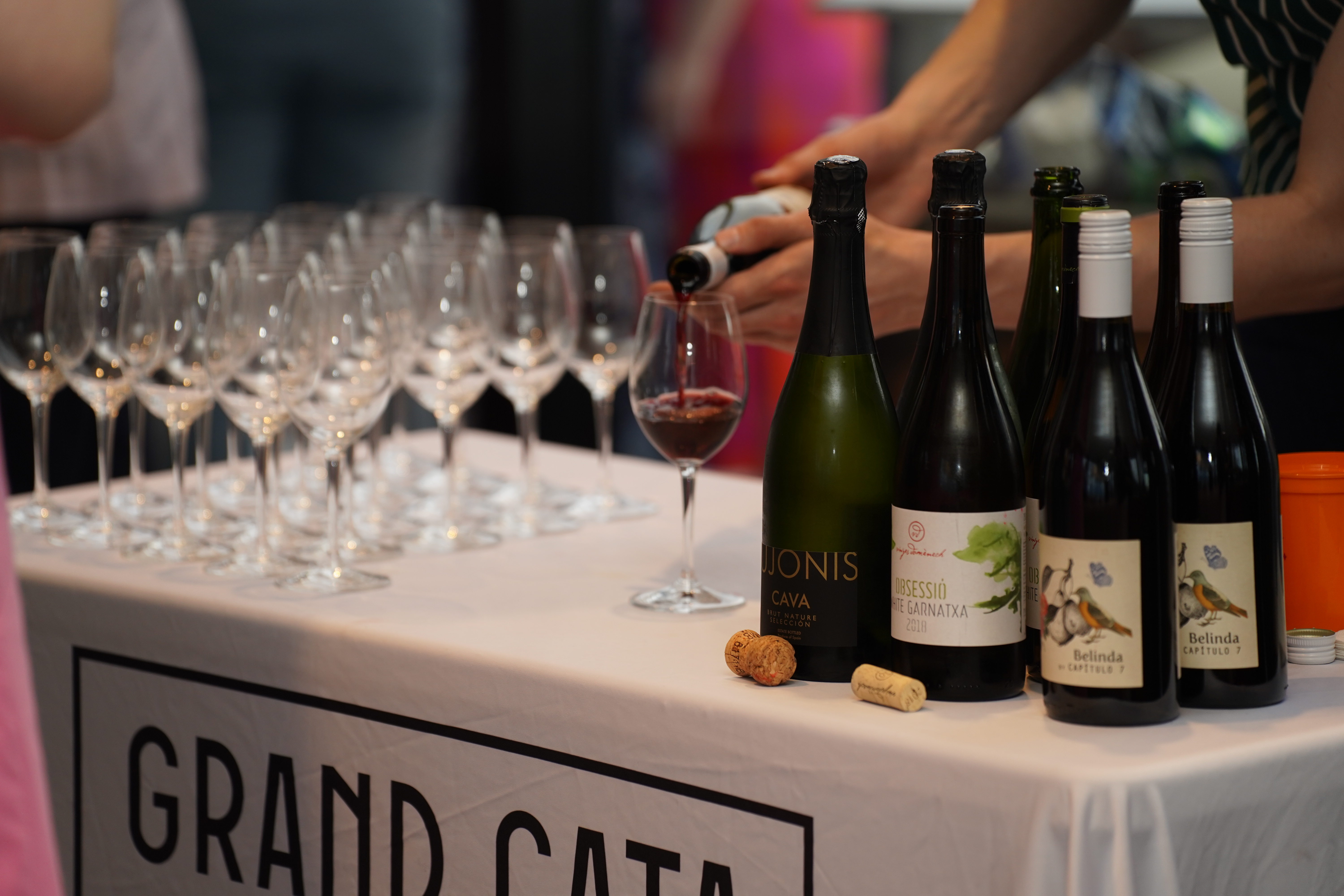 Grand Cata wine bar with bottles being poured